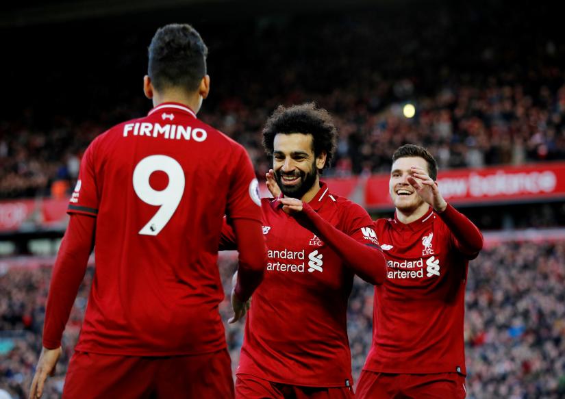 Premier League - Liverpool v AFC Bournemouth - Anfield, Liverpool, Britain - February 9, 2019 Liverpool`s Mohamed Salah celebrates scoring their third goal with Roberto Firmino and Andrew Robertson REUTERS