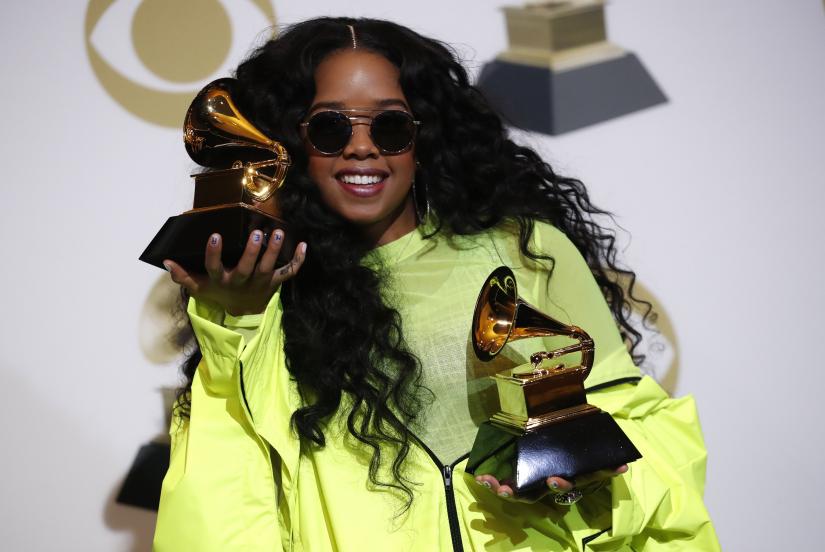 61st Grammy Awards - Photo Room - Los Angeles, California, U.S., February 10, 2019 - H.E.R. poses backstage with her awards for Best R&B Album for 'H.E.R.' and Best R&B Performance for 'Best Part.' REUTERS
