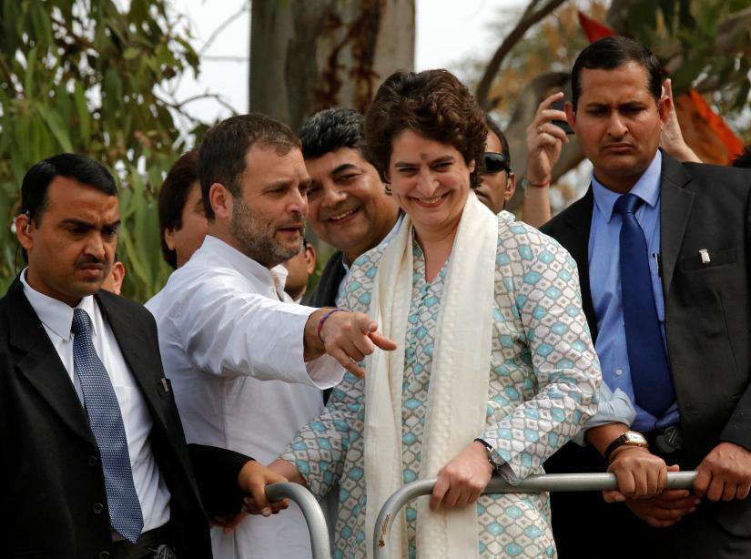 Rahul Gandhi, President of India`s main opposition Congress party, flanked by his sister and a leader of the party Priyanka Gandhi Vadra, gestures during a roadshow in Lucknow, India, February 11, 2019. REUTERS