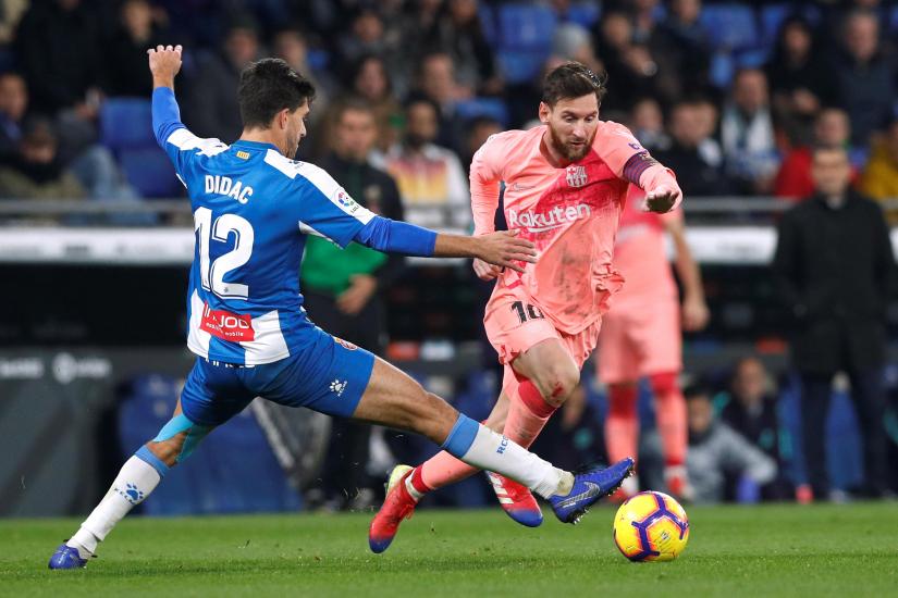 Football - La Liga Santander - Espanyol v FC Barcelona - RCDE Stadium, Barcelona, Spain - December 8, 2018 Barcelona`s Lionel Messi in action with Espanyol`s Didac Vila. REUTERS