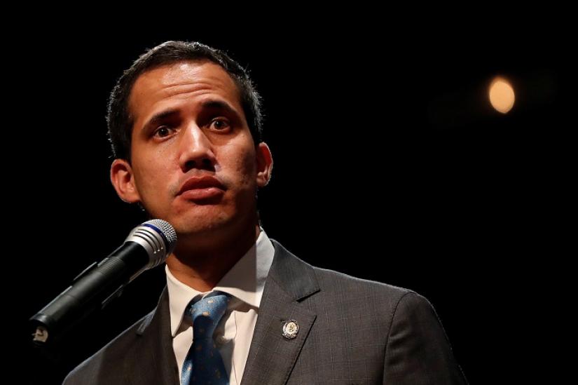 Venezuelan opposition leader Juan Guaido, who many nations have recognized as the country`s rightful interim ruler, talks with students in Caracas, Venezuela February 11, 2019. REUTERS