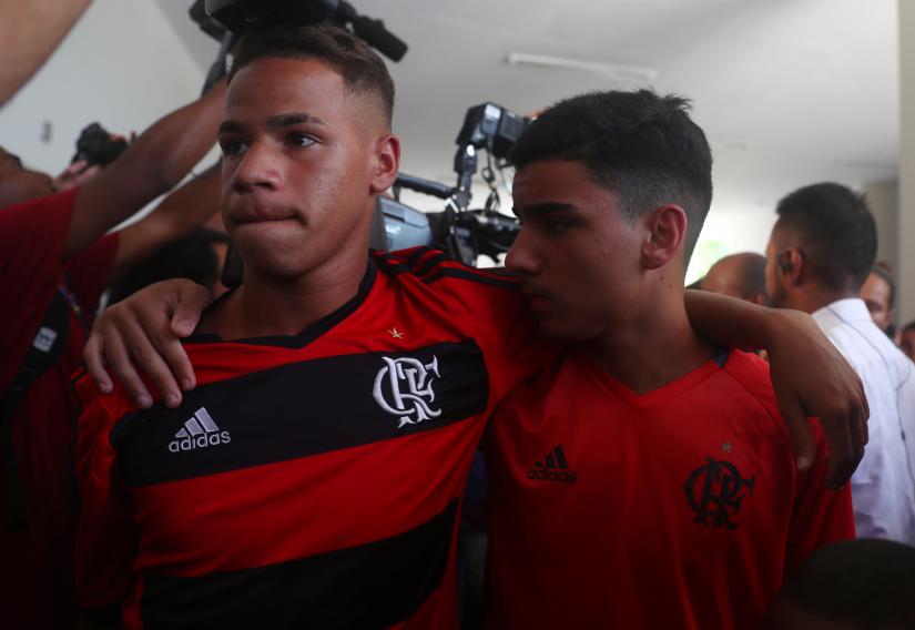 Team mates of teenage soccer player Samuel Thomas de Souza Rosa, who died in the fire that swept through Flamengo`s training ground attend his burial, in Rio de Janeiro, Brazil February 11, 2019. REUTERS