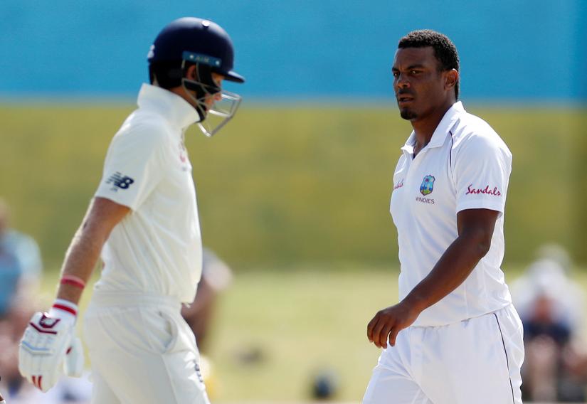 Cricket - West Indies v England - Third Test - Darren Sammy National Cricket Stadium, St Lucia - February 12, 2019 West Indies` Shannon Gabriel and England`s Joe Root Action Images via Reuters