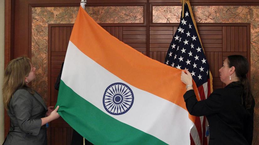 REPRESENTATIVE IMAGE: Technical Sergeant Julie Taylor (R) and Shanan Guinn display the flags of India and the United States before a bilateral meeting in Singapore June 4, 2010. REUTERS/File Photo