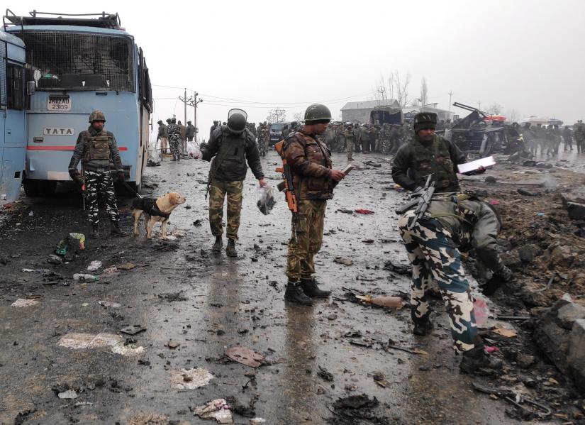 Indian soldiers examine the debris after an explosion in Lethpora in south Kashmir`s Pulwama district February 14, 2019. REUTERS