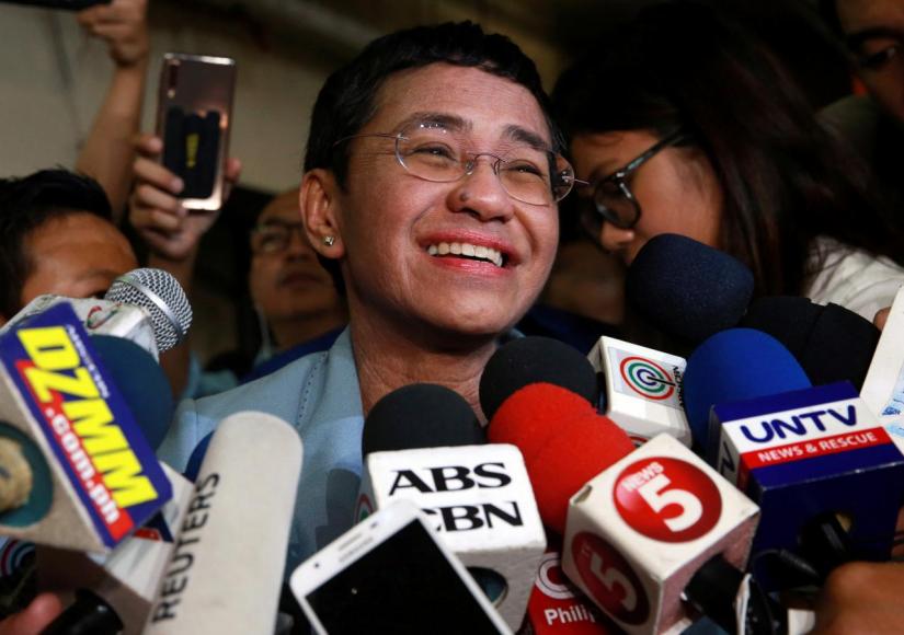 Maria Ressa, the CEO of online news platform Rappler, speaks to the media after posting bail at a Manila Regional Trial Court in Manila City, Philippines, February 14, 2019. REUTERS