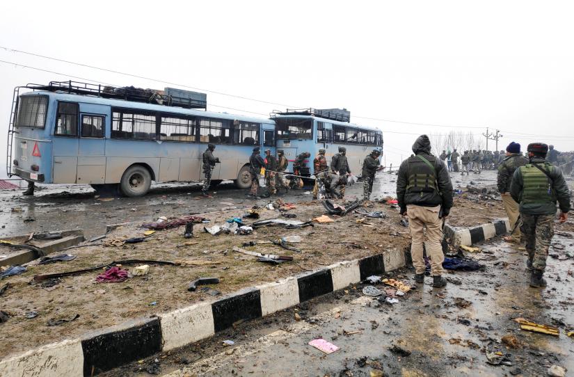 Indian soldiers examine the debris after an explosion in Lethpora in south Kashmir`s Pulwama district February 14, 2019. REUTERS