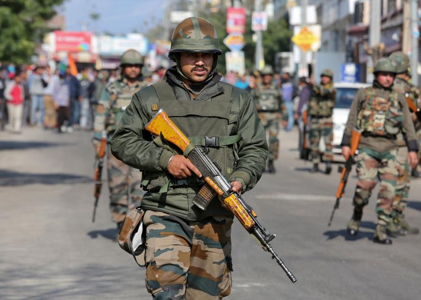 Indian Army soldiers patrol a street during a curfew in Jammu, February 16, 2019. REUTERS