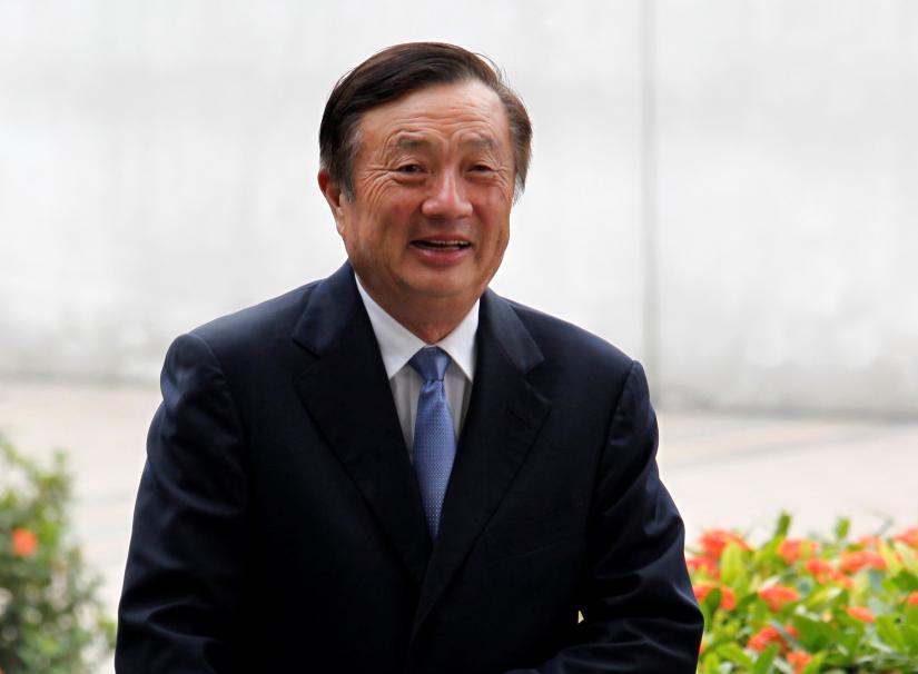 FILE PHOTO: Huawei CEO and founder Ren Zhengfei walks inside Huawei`s headquarters in the southern Chinese city of Shenzhen, Guangdong province, China October 16, 2013. REUTERS