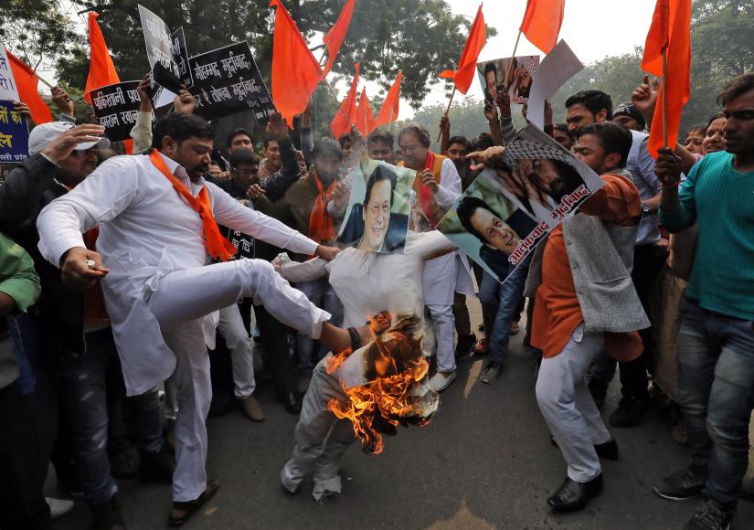 Activists from Hindu Sena, a right wing Hindu group, burn an effigy depicting Pakistan`s Prime Minister Imran Khan during a protest against the attack on a bus that killed 44 Central Reserve Police Force (CRPF) personnel in south Kashmir on Thursday, in New Delhi, India, February 15, 2019. REUTERS