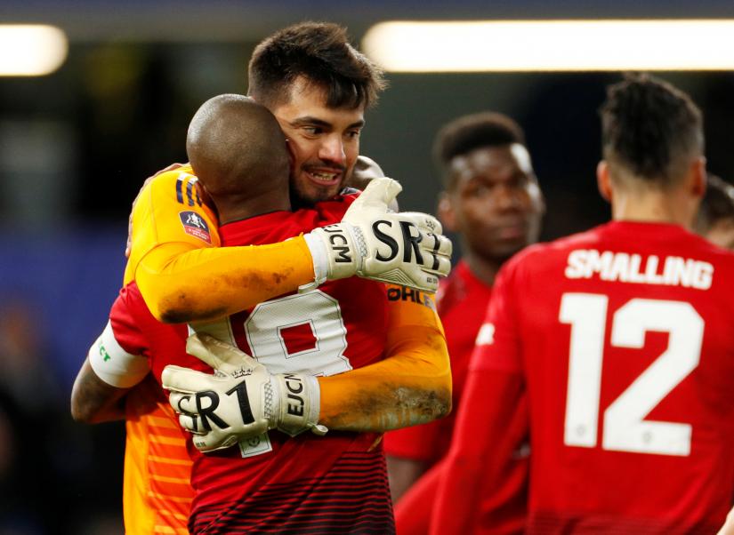 FA Cup Fifth Round - Chelsea v Manchester United - Stamford Bridge, London, Britain - February 18, 2019 Manchester United`s Sergio Romero celebrates with Ashley Young after the match Action Images via Reuters