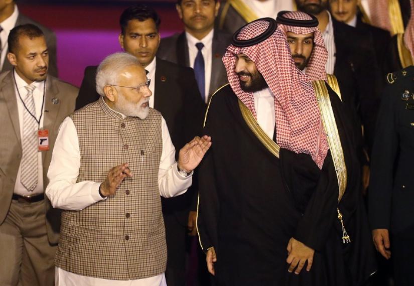 India`s Prime Minister Narendra Modi talks to Saudi Arabia`s Crown Prince Mohammed bin Salman upon his arrival at an airport in New Delhi, India, February 19, 2019. REUTERS