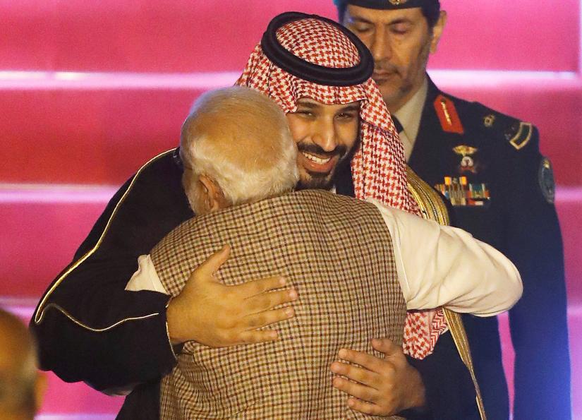 Saudi Arabia`s Crown Prince Mohammed bin Salman hugs India`s Prime Minister Narendra Modi upon his arrival at an airport in New Delhi, India, February 19, 2019. Picture taken February 19, 2019. REUTERS