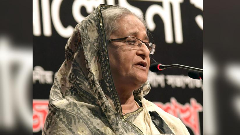 Prime Minister Sheikh Hasina addresses a discussion organized by Bangladesh Awami League marking Amar Ekushey and International Mother Language Day in Dhaka on Friday (Feb 22).