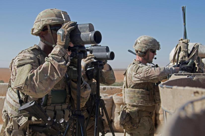 US Soldiers surveil the area during a combined joint patrol in Manbij, Syria, November 1, 2018. Courtesy Zoe Garbarino/U.S. Army/Handout via REUTERS/File Photo