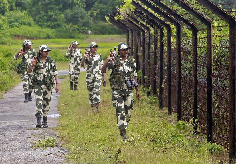 Female personnel of India`s Border Security Force patrol along the fencing of the India-Bangladesh international border ahead of India`s Independence Day celebrations, at Dhanpur village in India`s northeastern state of Tripura, August 2014. REUTERS/File Photo