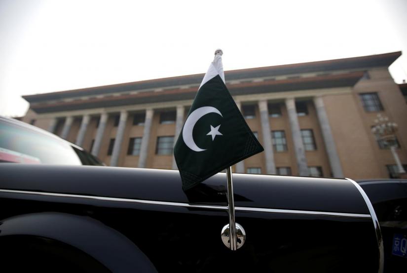 A car with a Pakistani flag waits for Pakistani Minister Imran Khan outside the Great Hall of the People during his visit in Beijing, China, November 3, 2018. REUTERS/File Photo