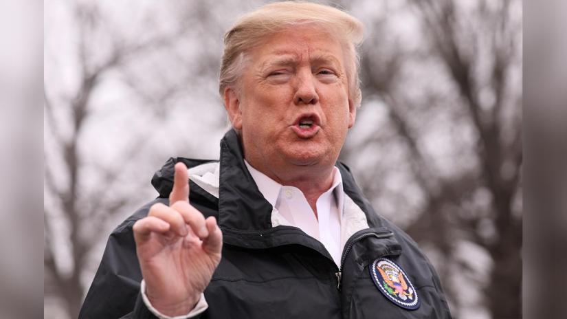 US President Donald Trump talks to reporters as he departs to visit storm-hit areas of Alabama from the White House in Washington, US, March 8, 2019. REUTERS/File Photo