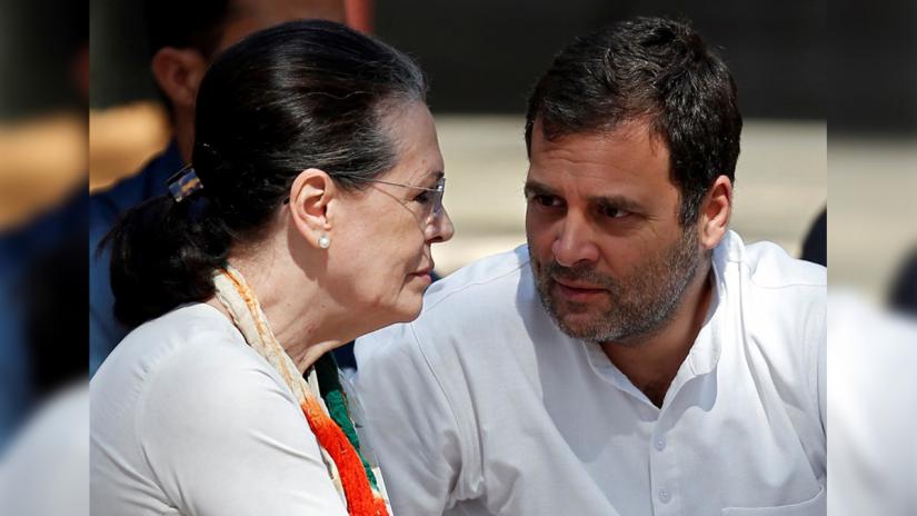 Rahul Gandhi, President of India`s main opposition Congress party, speaks with his mother and leader of the party Sonia Gandhi at a prayer meet during their visit to Gandhi Ashram in Ahmedabad, India, March 12, 2019. REUTERS