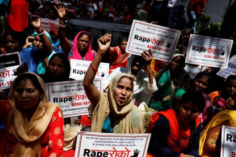 Women shout slogans during a protest organised by the Delhi Commission for Women against the rape of an eight-year-old girl, in Kathua, near Jammu and a teenager in Unnao, Uttar Pradesh state, in New Delhi, India April 13, 2018. REUTERS/File Photo