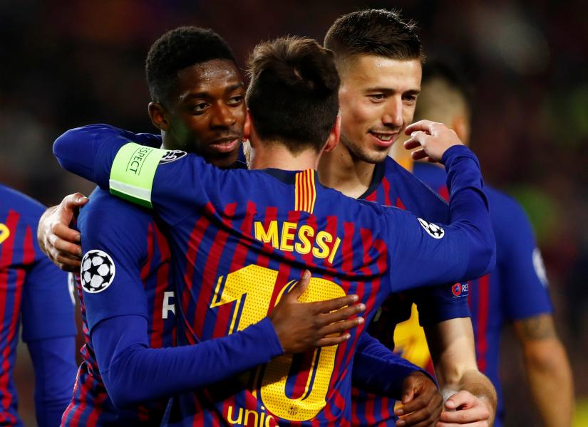 Barcelona`s Ousmane Dembele celebrates scoring their fifth goal with Ousmane Dembele and Clement Lenglet against Olympique Lyonnais at Camp Nou, Barcelona, Spain on March 13, 2019. REUTERS