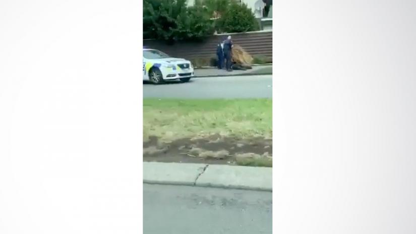 Police apprehend a suspect following shootings at two mosques in Christchurch, New Zealand March 15, 2019, in this still image obtained from a social media video. Courtesy of Twitter @ROBERT22051432/Social Media via REUTERS.
