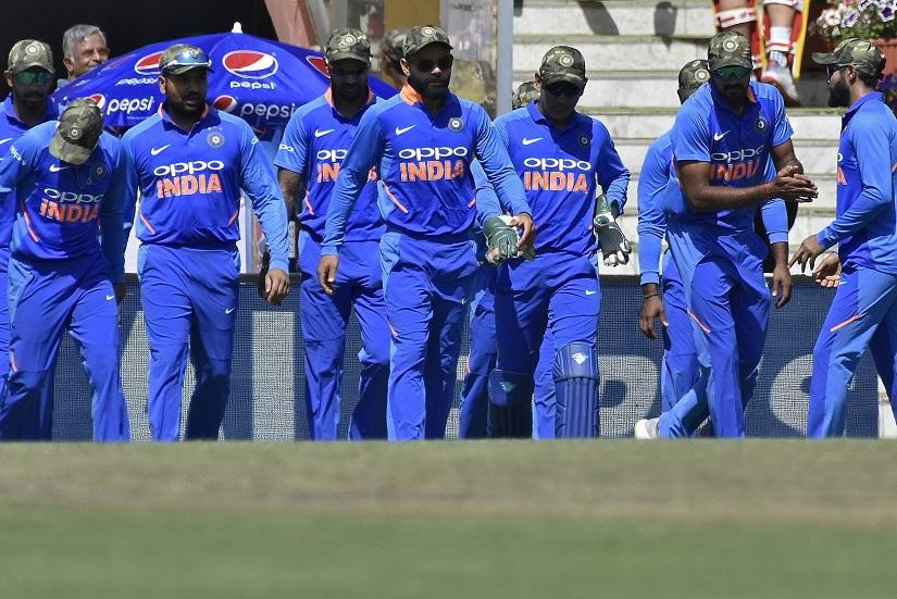 India`s captain Virat Kohli (C) and his teammates wearing army camouflage-style caps walk onto the field against Australia at Jharkhand State Cricket Association Stadium, Ranchi, India on March 8, 2019. REUTERS/File Photo