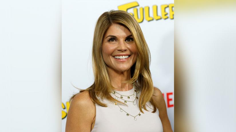 Cast member Lori Loughlin poses at the premiere for the Netflix television series `Fuller House` at The Grove in Los Angeles, California, US, February 16, 2016. REUTERS/File Photo