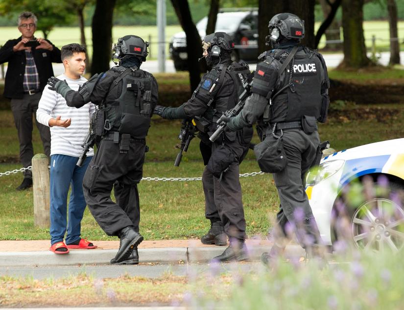AOS (Armed Offenders Squad) push back members of the public following a shooting at the Masjid Al Noor mosque in Christchurch, New Zealand,, March 15, 2019. REUTERS/SNPA/Martin Hunter
