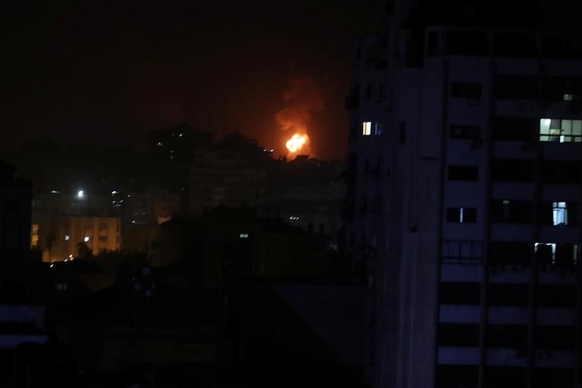 Smoke and flame are seen during an Israeli air strike in Gaza March 15, 2019. REUTERS