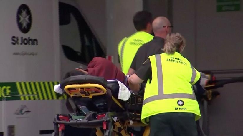 Emergency services personnel push stretchers carrying a person into a hospital, after reports that several shots had been fired, in central Christchurch, New Zealand March 15, 2019, in this still image taken from video. TVNZ/via REUTERS