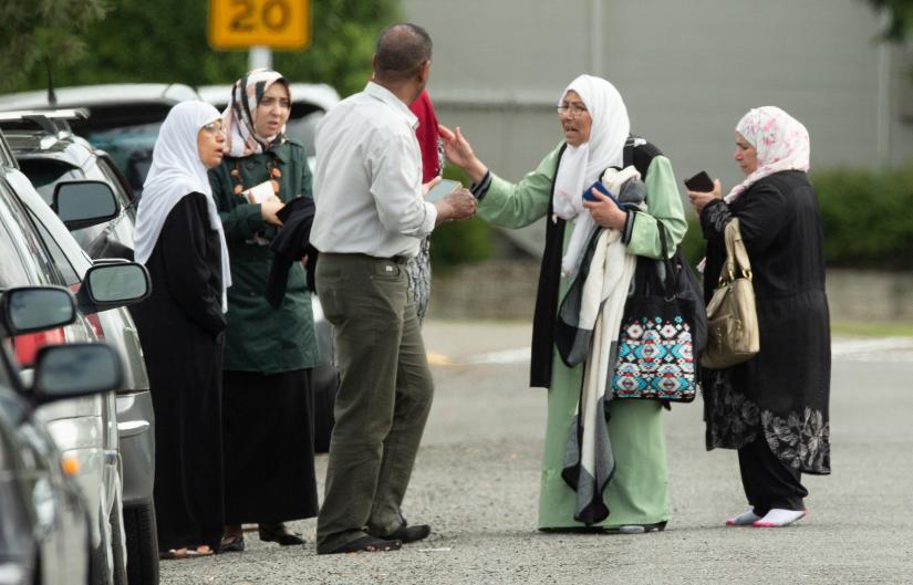 Members of a family react outside the mosque following a shooting at the Al Noor mosque in Christchurch, New Zealand, March 15, 2019. REUTERS