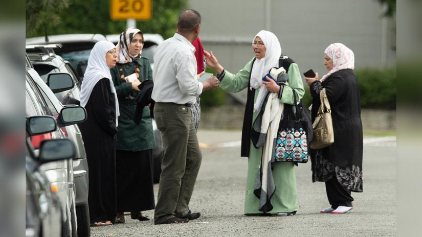 Members of a family react outside the mosque following a shooting at the Al Noor mosque in Christchurch, New Zealand, March 15, 2019. REUTERS/SNPA