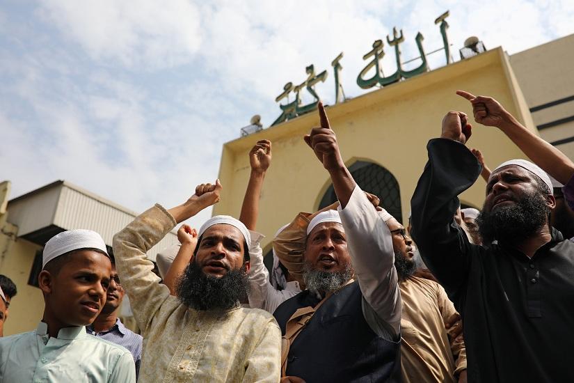 Muslims shout slogans as they condemn the Christchurch mosque attack in New Zealand, after Friday prayers at the Baitul Mukarram National Mosque in Dhaka, Bangladesh, March 15, 2019. REUTERS