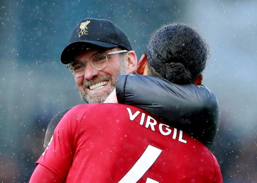 Premier League - Fulham v Liverpool - March 17, 2019 Liverpool manager Juergen Klopp celebrates with Virgil van Dijk after the match Action Images via Reuters
