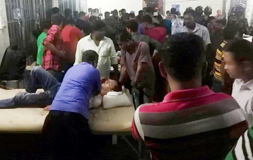 A wounded man is being treated at Baghaichhari health complex on Monday (Mar 18).  Dhaka Tribune