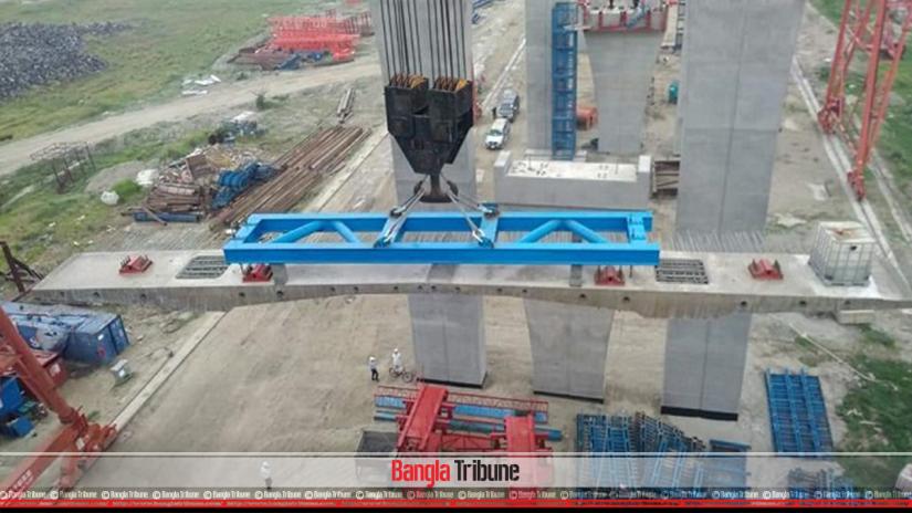 The first roadway slab was placed on the Zajira end of Padma Bridge on Tuesday (Mar 19).