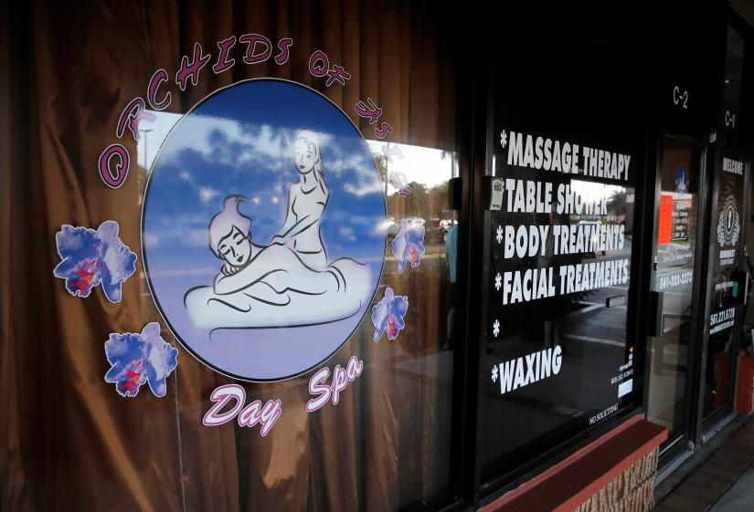 The front window of the Orchids of Asia Day Spa is shown in Jupiter, Florida, U.S. February 22, 2019. REUTERS