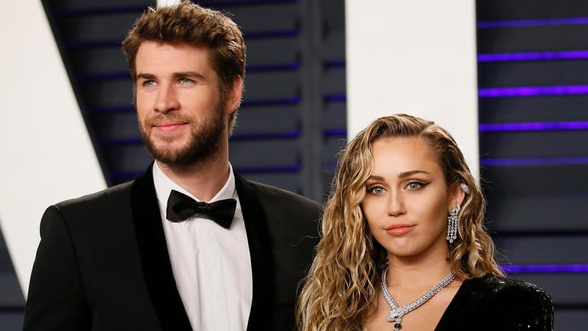Liam Hemsworth (L) and Miley Cyrus at 91st Academy Awards – Vanity Fair – Beverly Hills, California, US, Feb 24, 2019. REUTERS/File Photo