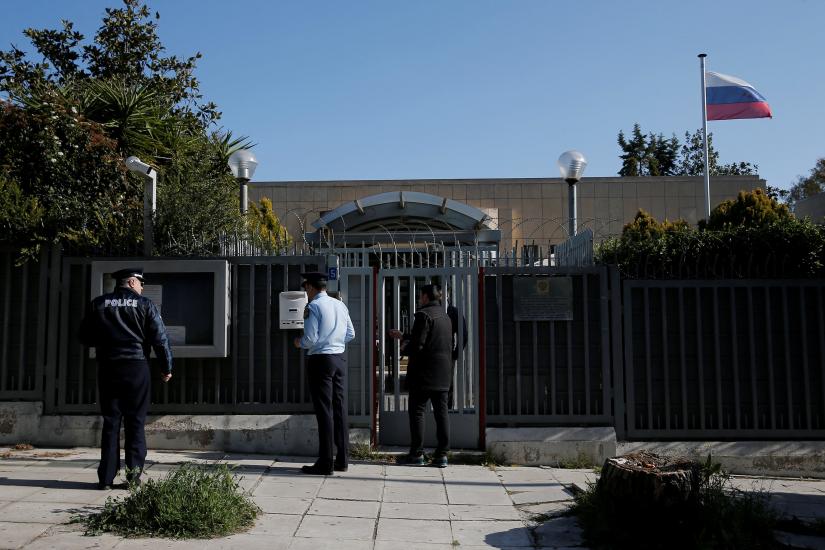 Police officers stand outside the Russian consulate after an explosion, in Athens, Greece March 22, 2019. REUTERS
