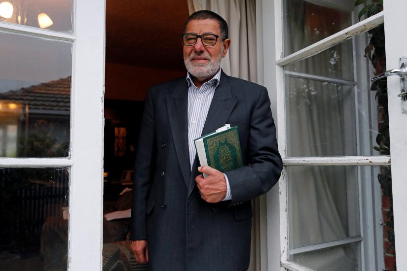 Imam Ibrahim Abdelhalim of the Linwood Mosque poses for a picture at the door of his house in Christchurch, New Zealand March 16, 2019. Picture taken March 16, 2019. REUTERS