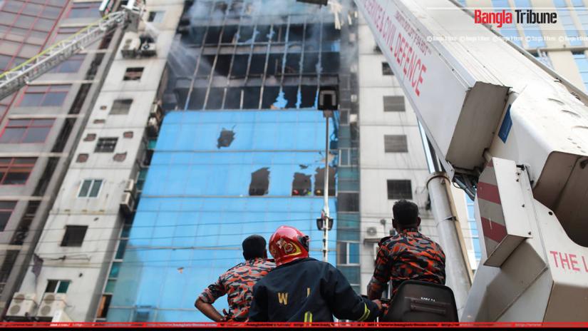 Firefighters attempt to extinguish a fire at a multi-storey commercial building in Dhaka, Bangladesh, March 28, 2019.