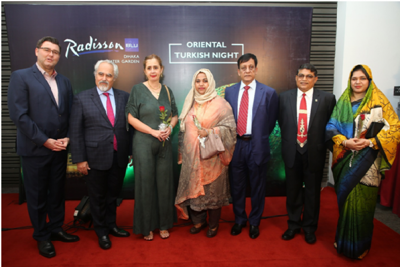 General Manager of Radisson Blu Dhaka Alexander Haeusler (Far left), Managing Director of SHDL Lt General Sabbir Ahmed (fifth) and CEO of SHDL Brig General Ridwan-Al-Mahmood posing for pictures with guests at Oriental Turkish Night organized by the hotel