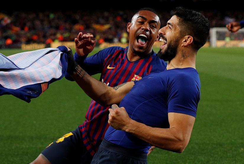 Barcelona`s Luis Suarez celebrates scoring their first goal with Malcom against Atletico Madrid at Camp Nou, Barcelona, Spain on Apr 6, 2019. REUTERS