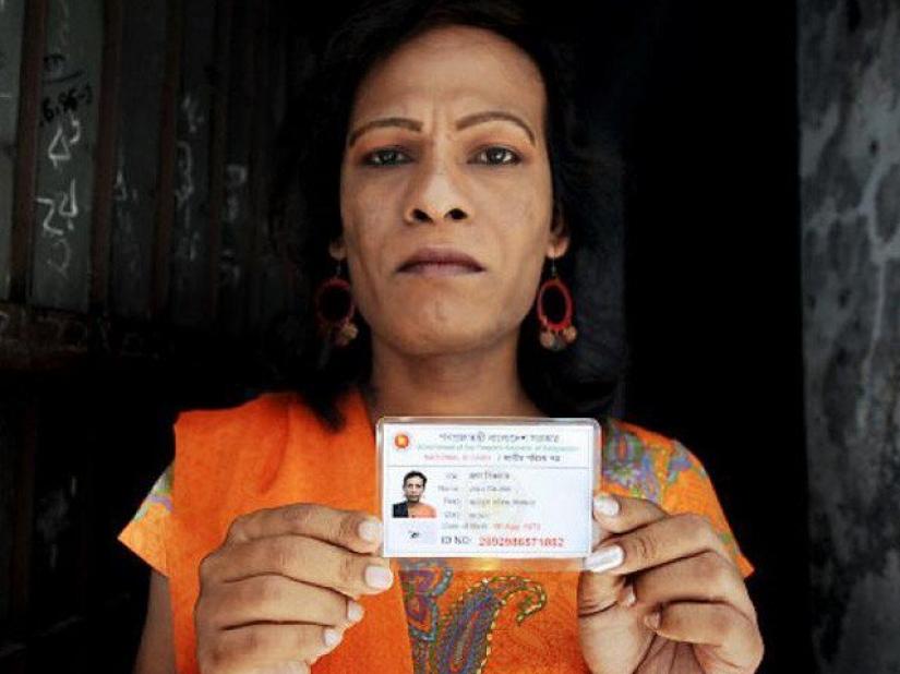 Bangladeshi `hijra` social worker Shikder holds her national identity card. REUTERS/File Photo