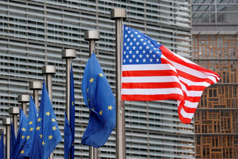 U.S. and European Union flags are pictured during the visit of Vice President Mike Pence to the European Commission headquarters in Brussels, Belgium February 20, 2017. REUTERS