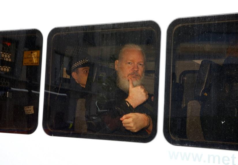 WikiLeaks founder Julian Assange is seen in a police van after was arrested by British police outside the Ecuadorian embassy in London, Britain April 11, 2019. REUTERS/File Photo