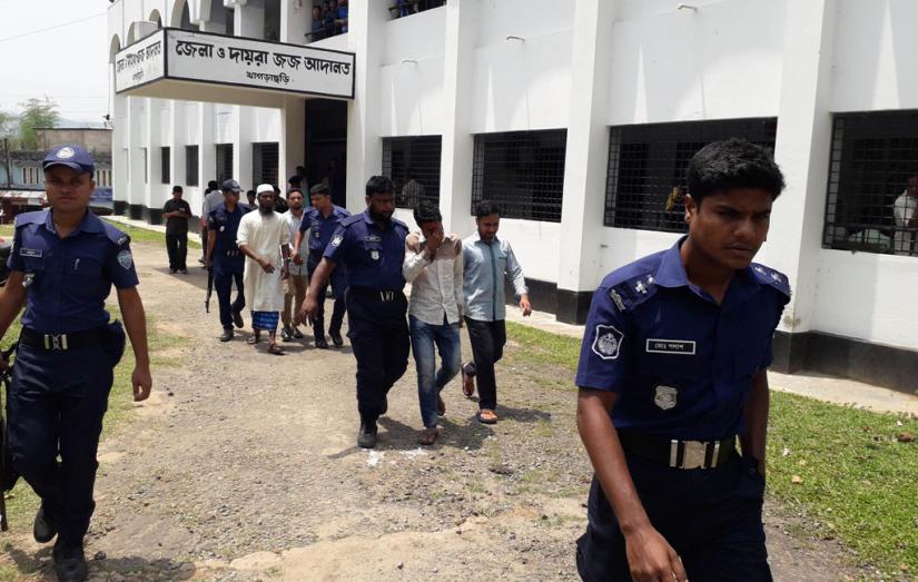 Police escort the convicts after verdict at the Khagrachhari District Court premises on Monday (Apr 15).