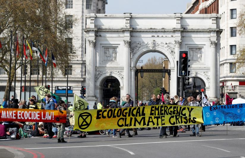 Climate change activists attend an Extinction Rebellion protest in London