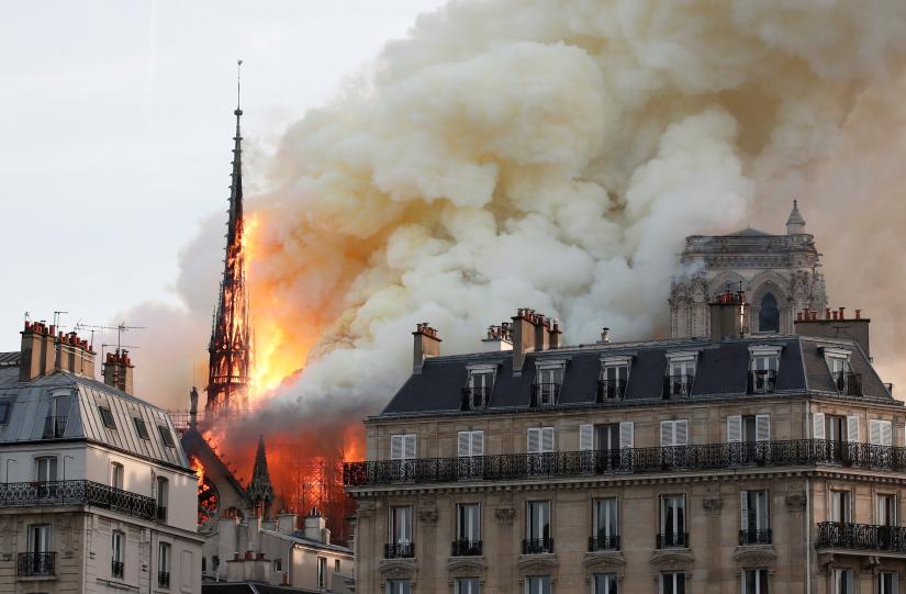 Smoke billows from Notre Dame Cathedral after a fire broke out, in Paris, France April 15, 2019. REUTERS/Benoit Tessier